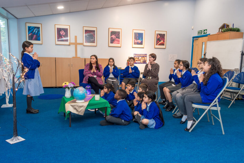 a picture of a class praying