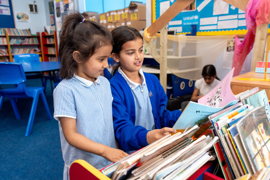 a picture of a group of students reading books