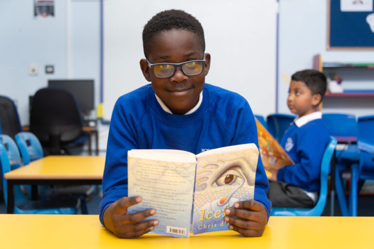 a picture of a student reading a book