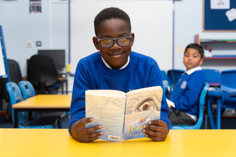 a picture of a student reading a book