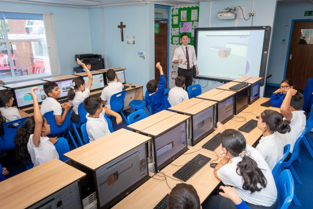 a picture with their hands up in class
