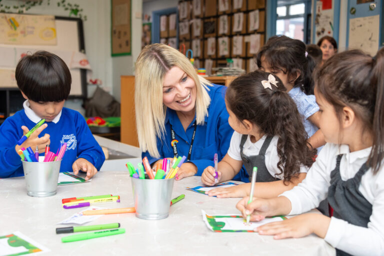 a picture of a teacher helping the students