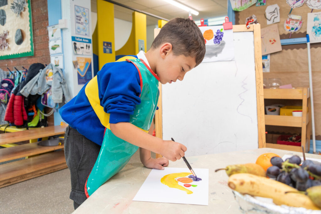 a picture of a student with a paint brush