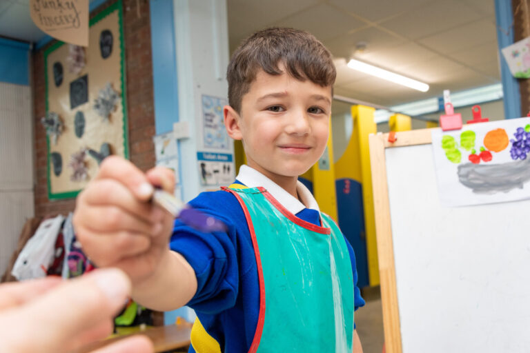 a picture of a student with a paint brush